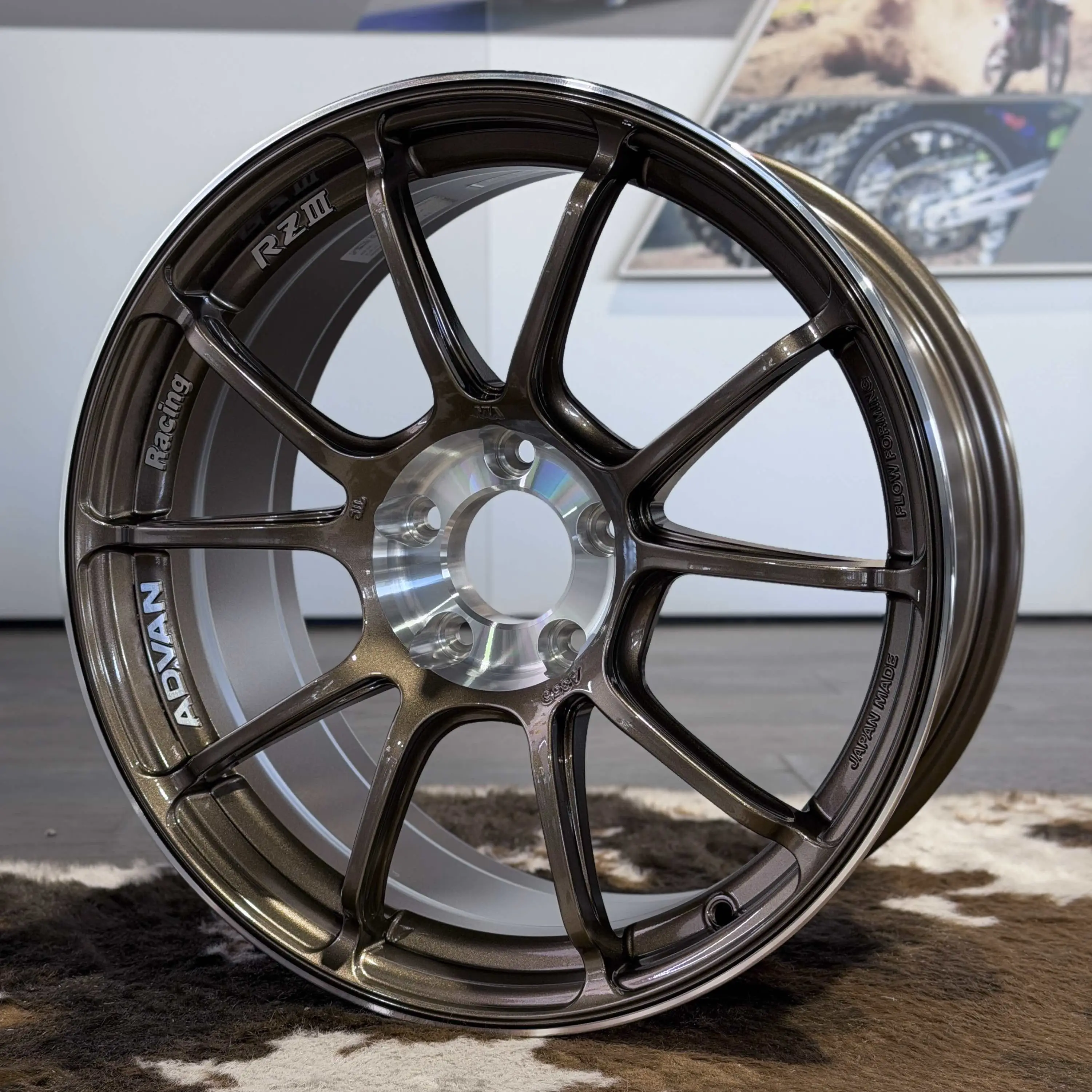 Close up showcasing the polished diamond cut outer rim ring and matching inner center circle on a UBC finish wheel