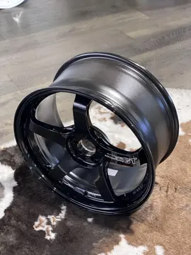 Detailed product shot showcasing the subtle metallic shine and premium deep black coating of a standalone Advan wheel