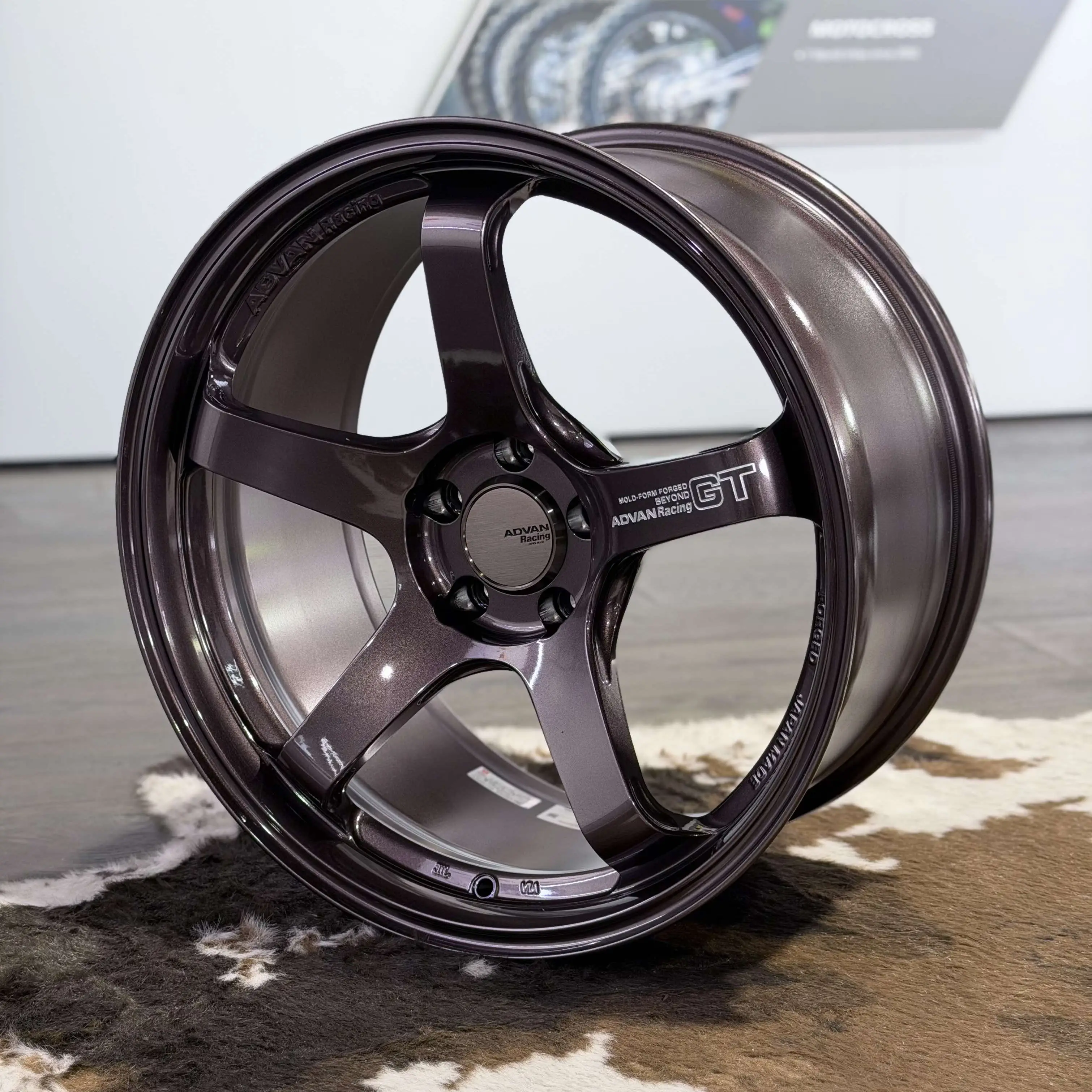 Three quarter studio view highlighting the thick concave five spoke layout of an RCB Advan GT Beyond wheel