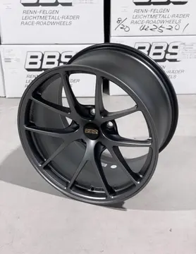 Side angle view illustrating the raw motorsport aesthetic and deep brake clearance of a standalone Matte Gray RIA wheel