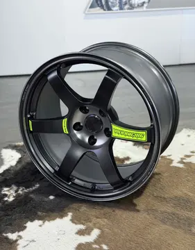 Center bore and 6-spoke layout of Matte Black RAYS Volk Racing TE37 SAGA SL M-Spec wheel with green accents