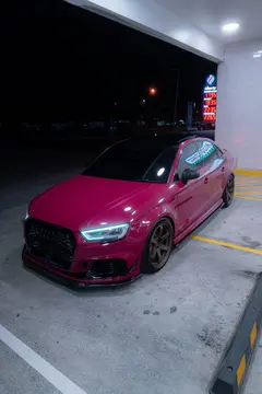 Ruby Star Pink Audi 8V RS3 Sedan side view fitted with Matte Gun Bronze RAYS Volk Racing TE37 SAGA SL wheels - KA Autosport Australia